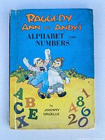 Front cover showing title, illustration, wear
