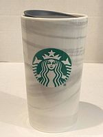 Front view of ceramic travel mug showing marble finish and Starbucks logo