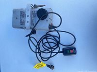 Top view showing full unit, wired remote and power cord