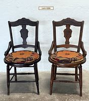 Front view of both Eastlake chairs showing frames and cushions