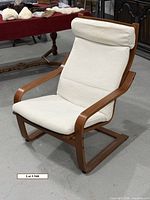 Front view of Ikea Poäng chair showing frame and cushion