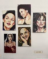 Group shot of all five acrylic portraits mounted on wall