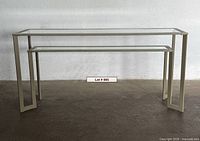 Front view of metal framed glass console table