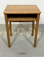 front view of oak school desk showing open cubby and overall structure