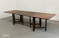 Table fully extended showing entire length and gate legs