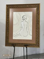 Full view of framed artwork on easel