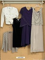 Group shot of all six garments hung for full-lot overview