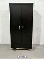 Front view of closed black metal cabinet