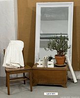 Group shot showing mirror, chair, chest, blanket, bookends, curtain panel