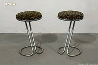 Front view of both chrome cantilever stools