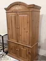 Front and side view of pine armoire showing overall form