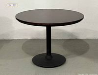 Full view of round pedestal table front angle
