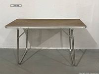 Full front view of folding table showing overall design and condition