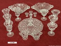 Full lot overview showing all crystal pieces grouped on red background