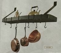 Installed view of wall-mount pot rack with hooks and sample pots