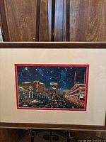 Las Vegas cityscape framed print in dark wood frame with cream and red mat