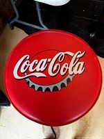 top view of Coca-Cola stool seat showing logo