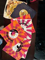 Stack of singles with Atlantic disc and three Phonodisc sleeves