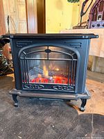 Front view lit showing flame effect and design details