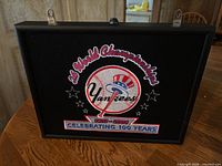 Front view of framed Yankees 26 World Championships 1903-2003 light-up sign