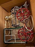 Contents of first box showing metal frame and colored light tubes