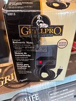Front of GrillPro universal rotisserie motor kit box showing model 60013 and motor with cord