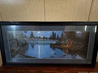 Landscape lake scene framed print in black frame, straight-on view