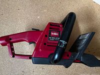 Left side view of Toro hedge trimmer showing brand label and handle
