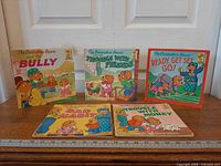 Five Berenstain Bears paperback books arranged front covers visible