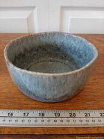 Angled top view showing interior glaze and size reference against ruler