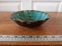 Side profile of scalloped drip-glaze bowl