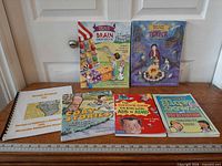 All six books laid out on surface