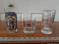 All three glasses side by side with ruler for scale