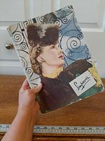 Front cover of Simpson's catalog held in hand