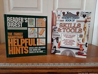 Both hardcover books standing upright showing full front covers