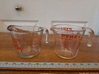 Both measuring cups side by side showing size and markings