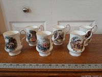 Six Royal Windsor bone china mugs arranged in a row with ruler for scale