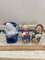 All three ceramic items with ruler for scale