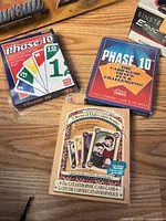 Phase 10 card games and A Series Of Unfortunate Events card game boxes