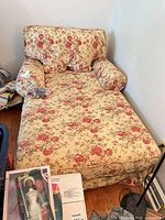 Front view of floral chaise lounge with cushion