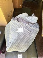 Entire weighted blanket folded showing minky dot side