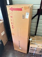 Sealed shipping box standing upright