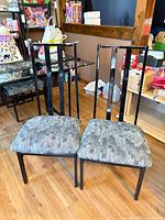Two chairs front view showing frame style and upholstery