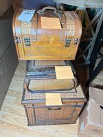 Stack of three trunks showing size difference and exterior materials