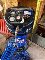 Control panel with dual gauges, regulator knob, hose connection