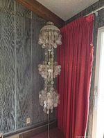 Full view of cascading capiz shell chandelier unlit