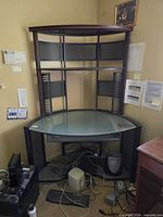 Full view of corner desk showing glass top, frame, and hutch