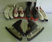 All five pairs of skates lined up on table