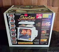 Front of original Ronco Showtime Rotisserie & BBQ Oven box showing model and graphics