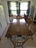 Full view of dining table with two chairs visible